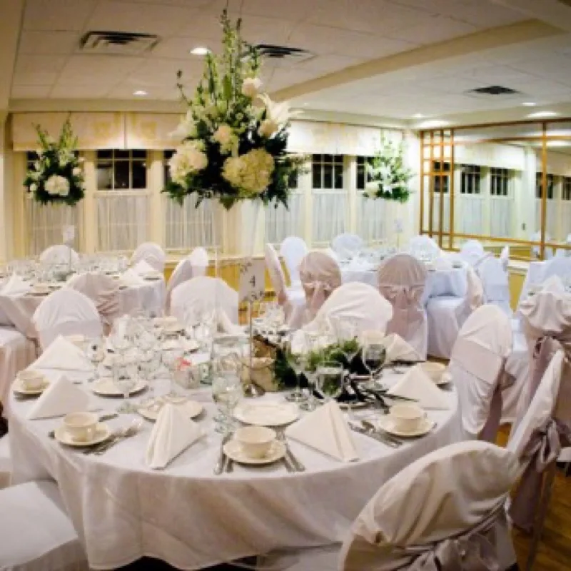 The Bellevue Room set for a wedding reception dinner